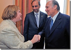 Glenview Village President Kerry Cummins shakes hands with the Aga Khan