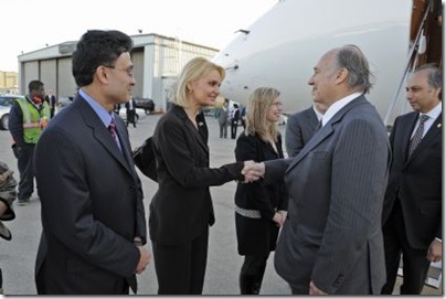 is greeted by Ms. Eva Sieradzki, Director of International Relations and Protocol at the office of the Governor of Illinois. The President of the Ismaili Council for the Midwestern USA looks on.