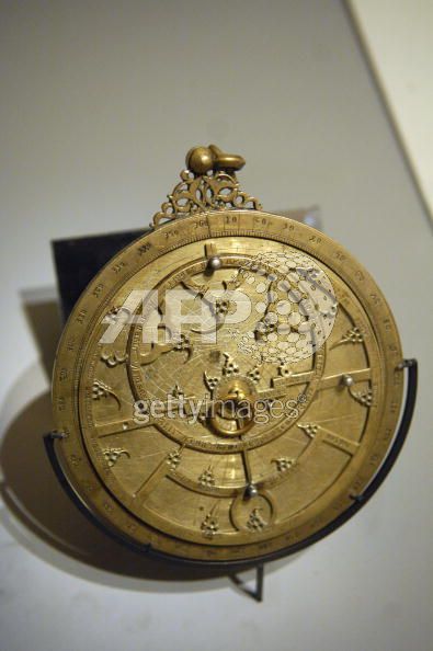 An astrolabe (Spain, 14th century) is presented in the exhibition 'The Song of the World', 02 October 2007 at the Musee du Louvre in Paris. The exhibition, which takes place from 05 October until 07 January 2008, outlines the evolution of art in Iran under the Safavid Dynasty (1501?1736) presenting a selection of masterpieces from the Aga Khan collection of Islamic art, as a preview to the opening of the Aga Khan Museum in Toronto. AFP PHOTO STEPHANE DE SAKUTIN
