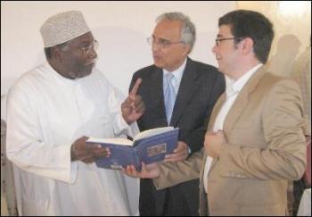 Dr Nader El-Bizri and Professor Azim Dr Nader El-Bizri and Professor Azim Nanji explaining to Professor Rashid some of the refe- rences in the book