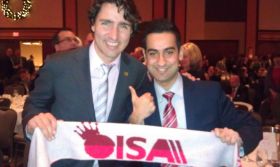 Al-Zoheb Gangani with Honourable Justin Trudeau, Member of Parliament for Papineau, holding up the Ottawa Ismaili Student’s Association (OISA) scarf on December 5th 2012 in Ottawa, ON.