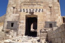 The badly damaged outer gate of Aleppo's Citadel.