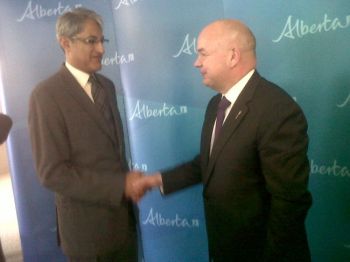 Malik Talib, president of the Aga Khan Council for Canada and Alberta Health Minister Fred Horne celebrate the next phase of the Multi-Generational Housing and Community Centre that will be used for supportive living for seniors.