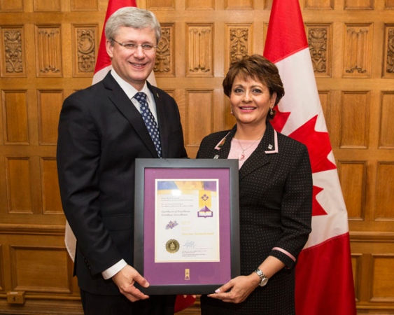 Shyrose Nurmohamed, Richmond, BC Montessori teacher receives an award from Prime Minister Stephen Harper