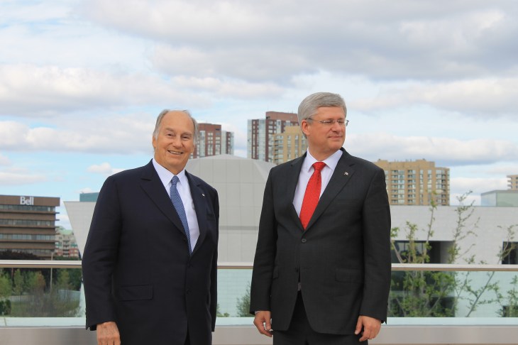 Mowlana Hazar Imam and Canadian Prime Minister Stephen Harper at the roof-top terrace of the Ismaili Centre, Toronto with the Aga Khan Museum in the background. [Image © Ismailimail/AM]