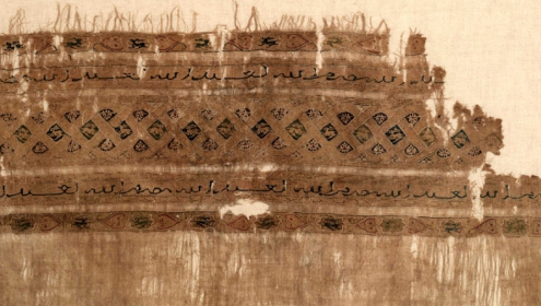 Fragment of fine linen tabby with silk and gold tapestry decoration, perhaps the end of a turban cloth. Made in Egypt in the Fatimid period, 12th century (ROM)