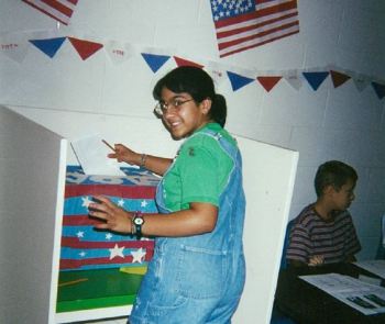 Leezia Dhalla, in fifth grade, submits her vote for Al Gore in a mock presidential election at her school in 2000. (Courtesy of Leezia Dhalla)