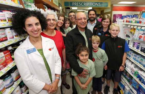 Running the newly renamed Heart pharmacies is a family business for the Rayanis, including, from left, Zahra Rayani-Kanji, Yasmine Rayani, Laurel Rayani, Naeema Rayani, 4, Farhan Kanji, founder Naz Rayani, Anigg Rayani, 7, Rasool Rayani, Rhys Watson, 8, Adele Fraser and Miles Watson, 10.   (Photograph By ADRIAN LAM, Times Colonist)