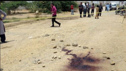 Pakistani residents gather at the scene of an attack by gunmen on a bus carrying Shiite Muslim in Karachi on May 13, 2015. At least 43 Shiite Muslims were killed and 13 wounded when gunmen opened fire on their bus in Karachi on May 13, 2015, Pakistani police said, in the second deadliest attack on the minority sect this year. (Rizwan Tabassum/AFP/Getty Images)