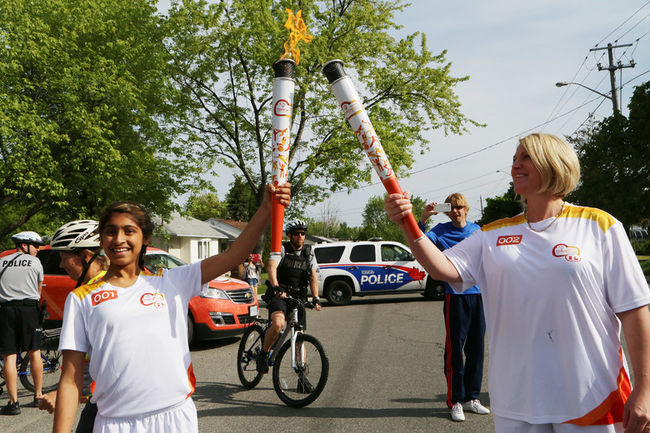 Maheen Awadia participates in 2015 Pan Am Games Torch Relay in Toronto