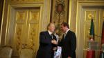 Prince Aga Khan shakes hands with Portuguese Prime Minister Pedro Passos Coelho during a meeting in Lisbon