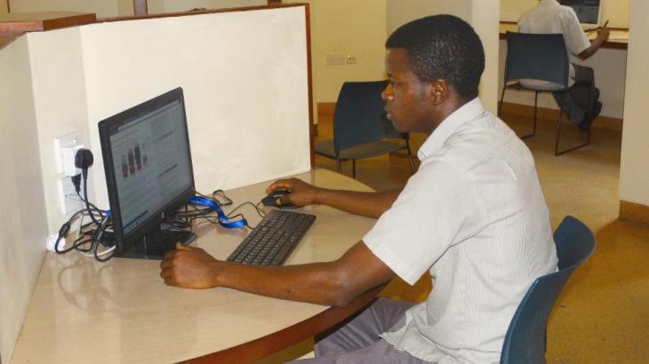 Student at the Aga Khan Academy, Mombasa undertaking his assignments using one of the computers at the school library. (Image via Coastweek)