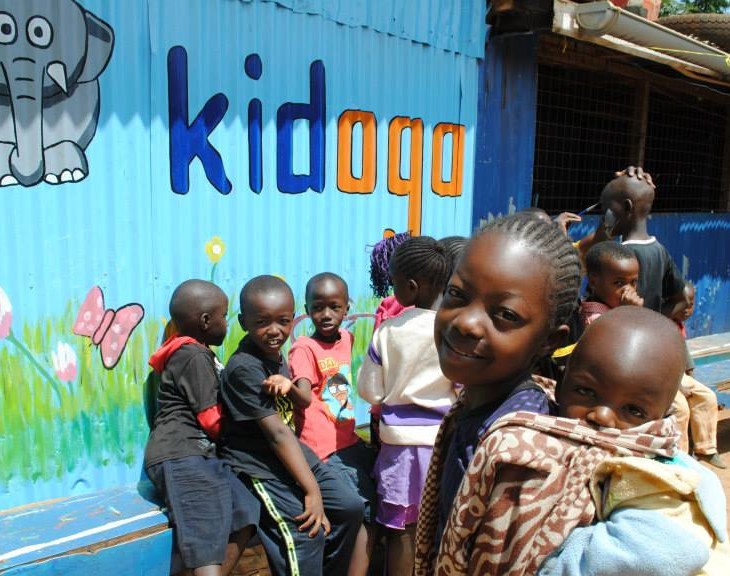 Faith, 11 years old, carries baby Richard to a Kidogo Centre in Kangemi, allowing her to go to school. Photograph: Sabrina Premji/Kidogo