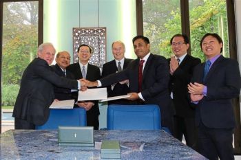 Lim and His Highness Prince Karim Aga Khan IV (centre) with officials at MOU signing in 2015 witnessing the handover of documents between ThinkCity and AKTC. Image credit: The Star