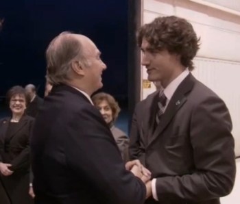 Justin Trudeau greets His Highness the Aga Khan as he arrives in Ottawa, Canada, to celebrate his Golden Jubilee in 2008. Looking on are Senator Mubina Jaffer, left, and MP Yasmin Ratansi. Mr. Trudeau was then an MP for his Papineau riding in the Quebec. (Image credit: The Ismaili)
