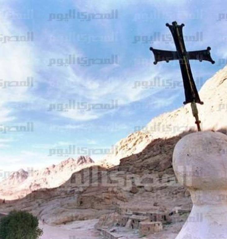 Fatimid minaret embraces church tower | Egypt Independent