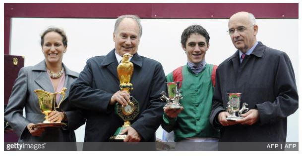 October 5, 2008: His Highness Prince Karim Aga Khan IV, his daughter Princess Zahra, Belgian jockey Christophe Soumillon (2dR) and trainer Alain de Royer Dupre (R) – all pose with trophies after winning the 87th Prix de l’Arc de Triomphe race riding favorite filly Zarkava on at Longchamp racetrack in Paris. Zarkava produced one of the greatest performances in racing history here at Longchamp as she became the first winner to come from stall one since Prince Royale II in 1964 to win the Prix de l’Arc de Triomphe. (Photo by Stephane de Saukutin AFP Photos/Getty Images)