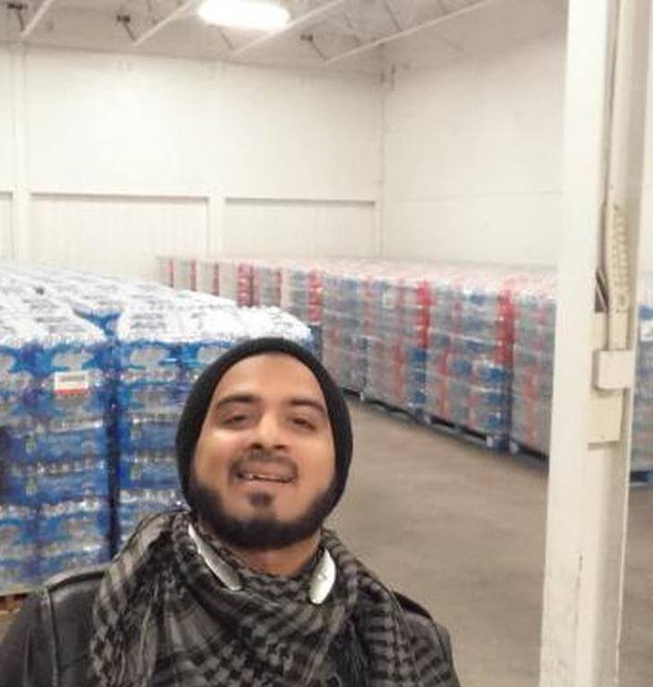 Sunny Taj: Water Boy Handing Out Water for Hugs in Flint | J-Vibe