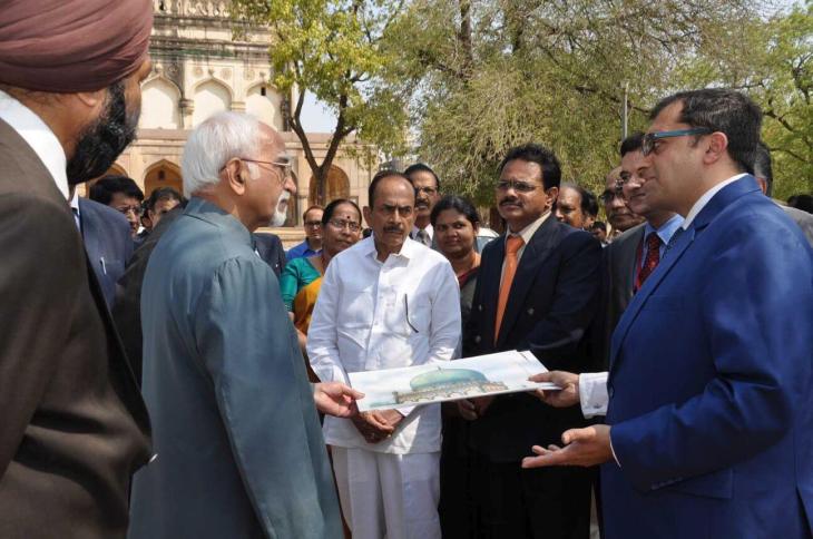 Mr. Ratish Nanda, CEO, AKTC appraising explains architecture and significance of the area to the Vice President of India Mr. Hamid Ansari along with Governor Sri E.S.L. Narasimhan and other senior government officials on their visit to Qutb Shahi Tombs (Image via Siasat Daily)