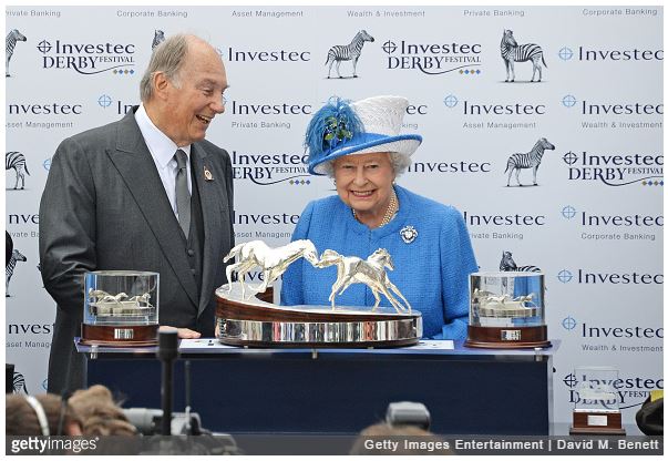 His Highness The Aga Khan receives the Investec Derby trophy for his winning horse Harzand from HRH Queen Elizbaeth II during Derby Day at the Investec Derby Festival, celebrating The Queen's 90th Birthday, at Epsom Downs Racecourse on June 4, 2016 in London, England.