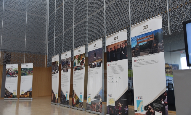 Thirty banners describing the work of the AKDN in countries around the world were arranged in the atrium of the Delegation building for the Imamat Day reception. (Image credit: AKDN / Safiq Devji)