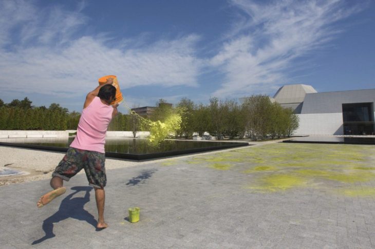 Imran Qureshi splatters paint on a huge expanse of concrete brick outside the Aga Khan Museum (Image credit: Toronto Star)