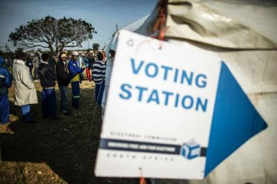 South African voters queue outside a polling station on August 3, 2016 during the municipal elections.
