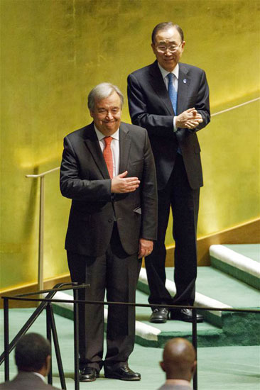 Antonio Guterres (front) gestures after he was appointed as the new UN Secretary-General at the UN headquarters in New York, Oct. 13, 2016. (Image credit: Seth Wenig/Associated Press)