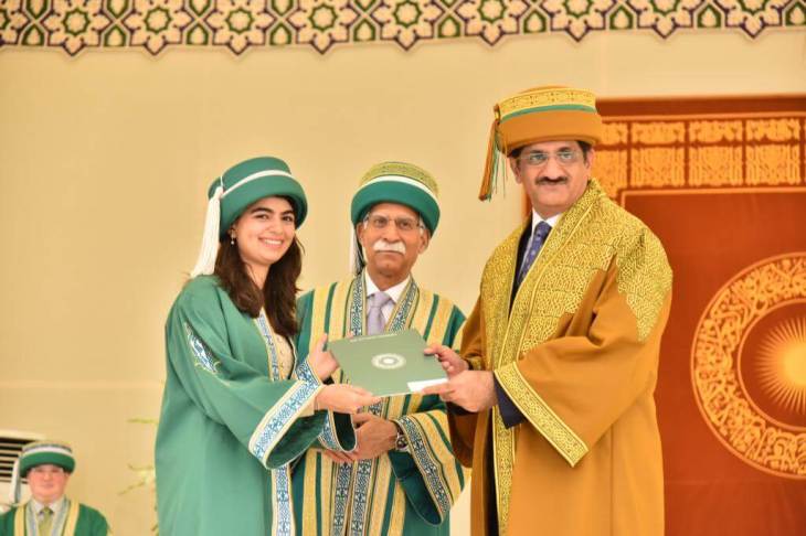 Sindh Chief Minister Syed Murad Ali Shah (right), was the chief guest at the Aga Khan University (AKU) 29th convocation. Pictured here is Sind Minister Murad with AKU President, Firoz Rasul (center) and a smiling and proud graduate (left). (image credit AKU).