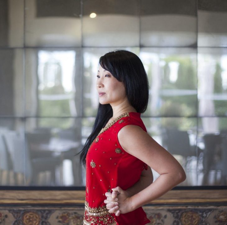 Yoga instructor YuMee Chung demonstrates a posture perfecting pose called Elbow Room at the Syrian inspired Diwan restaurant of the Aga Khan Museum overlooking the Ismaili Centre, Toronto. (Image credit: Anne-Marie Jackson via Toronto Star)