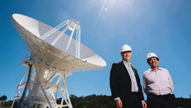 Station Director Ed Kruzins and Network Director Al Bhanji with Deep Space Station 36, the new antenna set to be officially opened on Thursday. Photo: Rohan Thomson