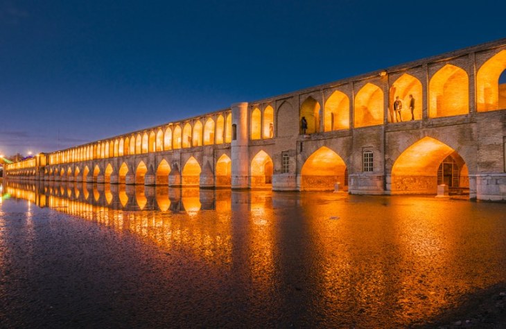 An image of Si-o-se Pol, one of eleven spectacular bridges in the city of Isfahan, Iran. Completed in 1602, the structure is nearly 1,000 feet long. (Image credit: Getty Images via Architectural Digest)