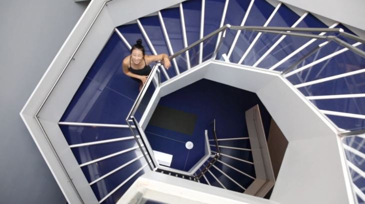 Yoga instructor YuMee Chung ready to demonstrate the 'Upward Spiral' yoga pose inspired by the twirling hexagonal staircase at the Aga Khan Museum. (Image credit: Anne-Marie Jackson via Toronto Star)