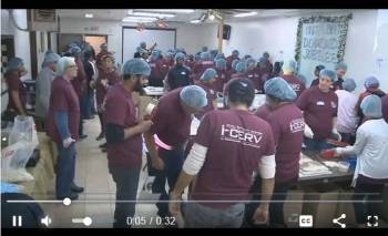 Ismaili Volunteers of Milwaukee, Wisconsin pack food to fight global hunger