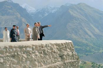 His Highness the Aga Khan, admiring the breath-taking view from the Baltit Fort, northern Paksitan, in conversation with Stefano Bianco, Director of Historic Cities Support Programme, part of the Aga Khan Trust for Culture. Prince Amyn Aga Khan looks on. 1996. The conservation of the over 700 years old Baltit Fort, the pre-eminent landmark onument in Gilgit-Baltistan, and the rehabilitation of the historic core of the Karimabad village in the Hunza Valley, were the Aga Khan Historic Cities Programme first major interventions, completed in 1996. These projects, as well as others in neighbouring Baltistan, have won a number of prestigious prizes, including the UNESCO Asia-Pacific Heritage Awards for Cultural Heritage Conservation (every year between 2002 and 2013); a Time Magazine “Best of Asia”; and a British Airways Tourism for Tomorrow Award. The Aga Khan Trust for Culture has completed dozens of other restoration projects in Baltistan and Hunza, but the area remains a treasure trove of scores of shrines, forts, mosques and other buildings of cultural and historical significance. - Photo credit: AKDN / Gary Otte