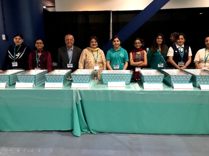 Volunteers waiting to serve with a smile.