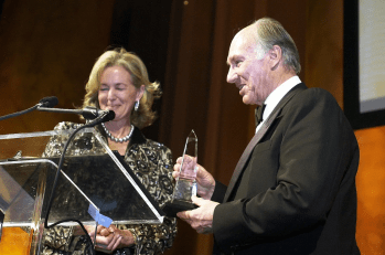 Washington DC, USA. January 26, 2005: His Highness Prince Karim Aga Khan IV receives the Vincent Scully Prize, a crystal obelisk, from Carolyn Schwenker Brody, Chair of the National Building Museum's Board of Trustees. Image credit: AKDN / Zahur Ramji