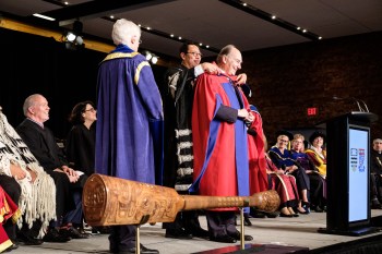 Vancouver, Canada. October 19, 2018. At an unprecedented joint ceremony in downtown Vancouver, the University of British Columbia (UBC) and Simon Fraser University (SFU) each conferred an honorary doctorate of laws from both schools to His Highness Prince Karim Aga Khan IV. Image credit: BC Premier John Horgan / Province of British Columbia