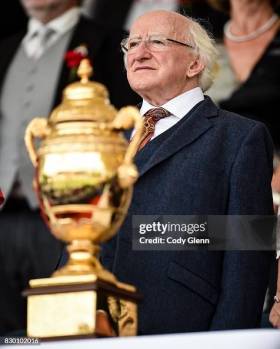 Dublin , Ireland. August 11, 2017: Uachtarán na hÉireann Michael D Higgins stands behind the Aga Khan Trophy during the Parade of Teams ahead of the FEI Nations Cup during the Dublin International Horse Show at RDS, Ballsbridge in Dublin. Image credit: Cody Glenn/Sportsfile via Getty Images